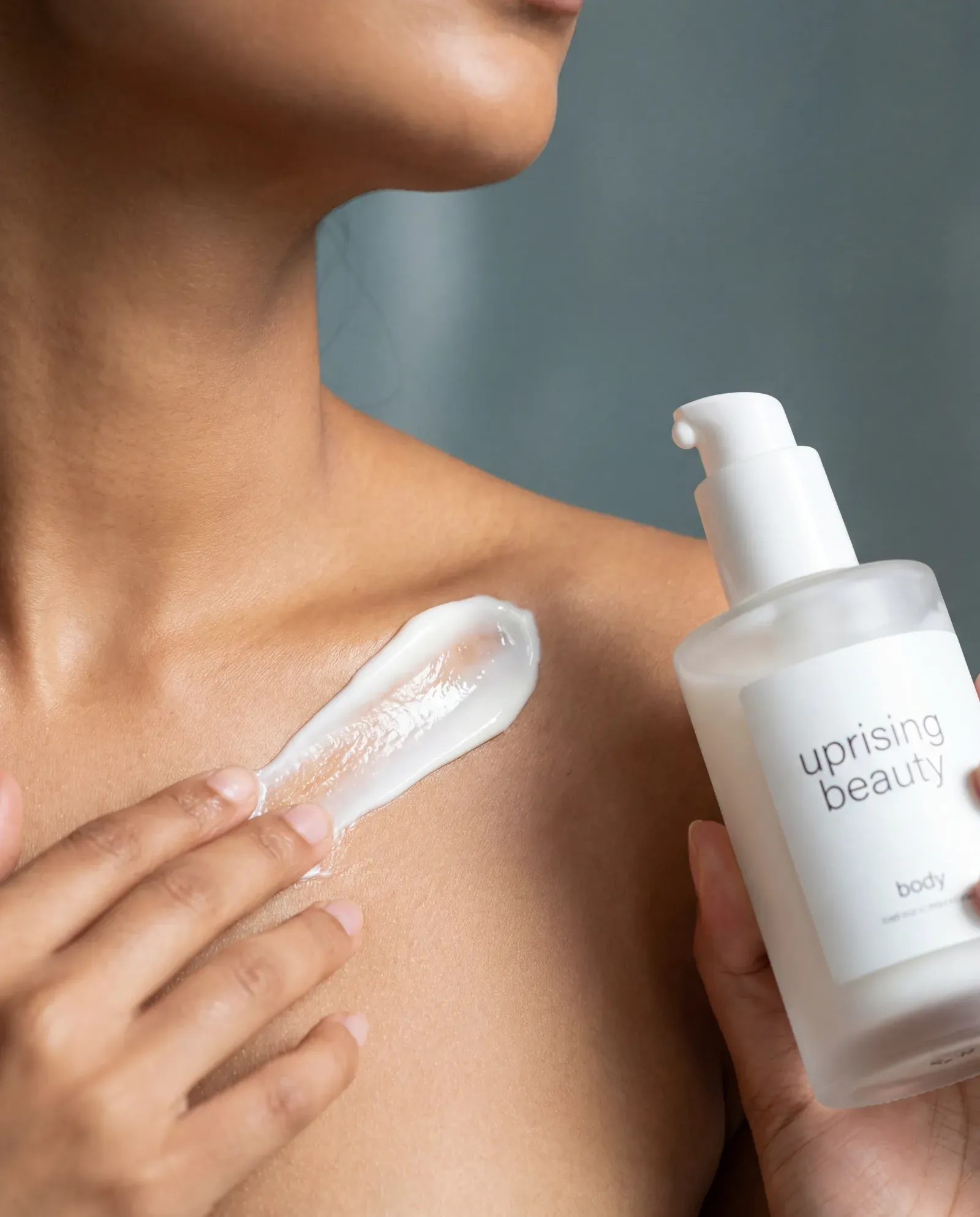 Body care category — body cream along the collarbone