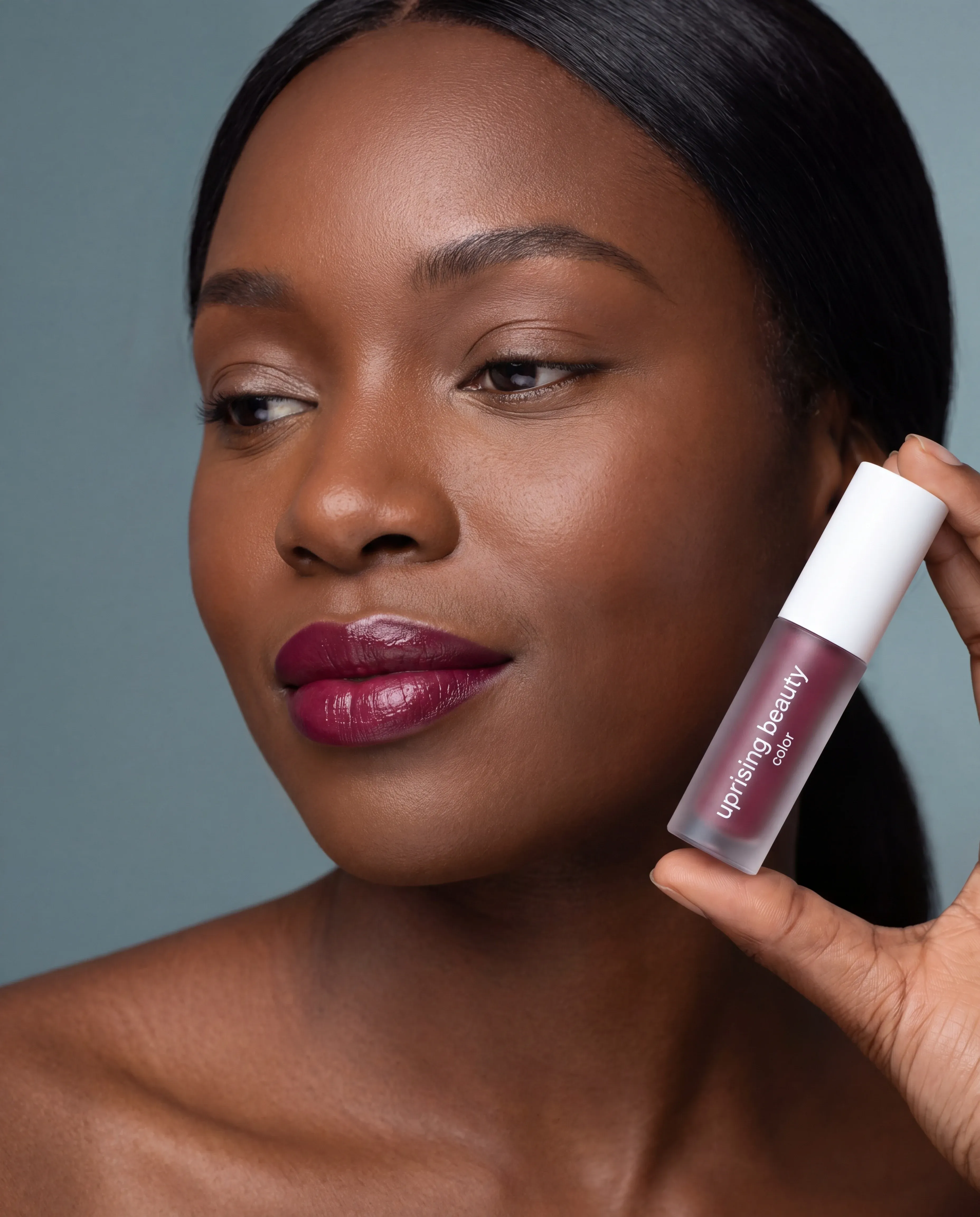 Color category — foundation, lip, blush and brow products around a woman's face