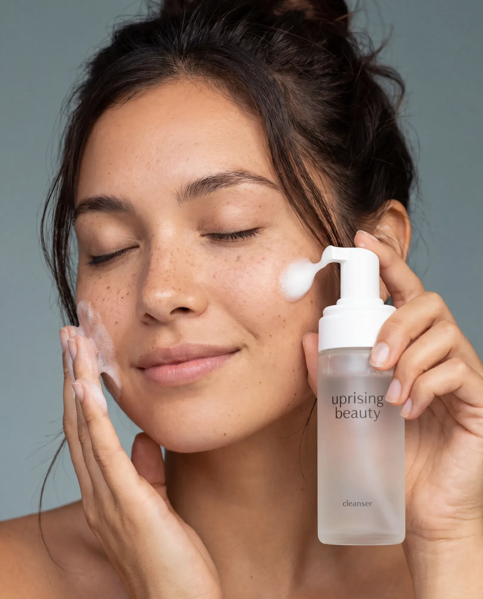 Skin category — products arranged around a woman's face by treatment zone